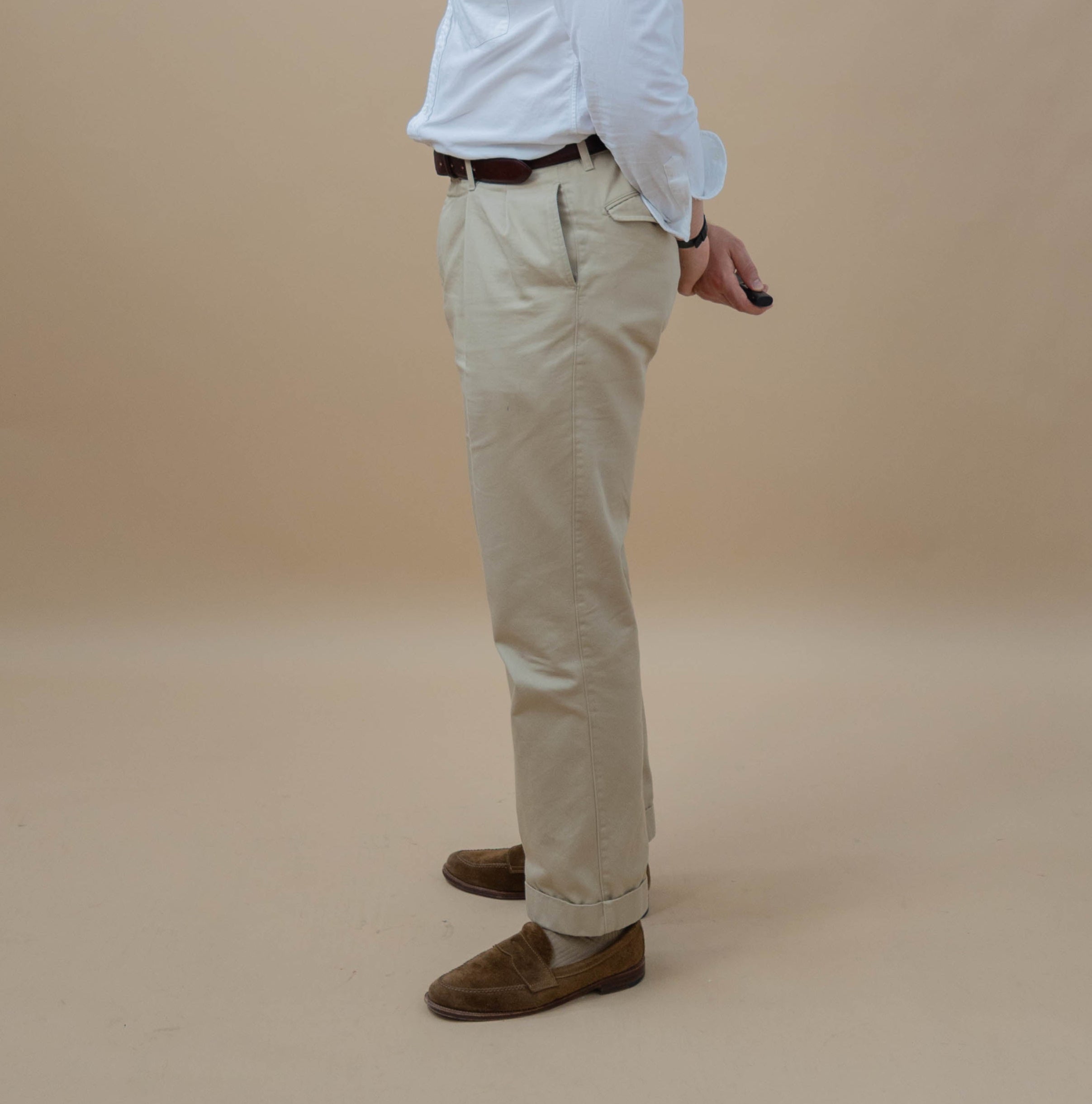 man wearing chinos facing to the side