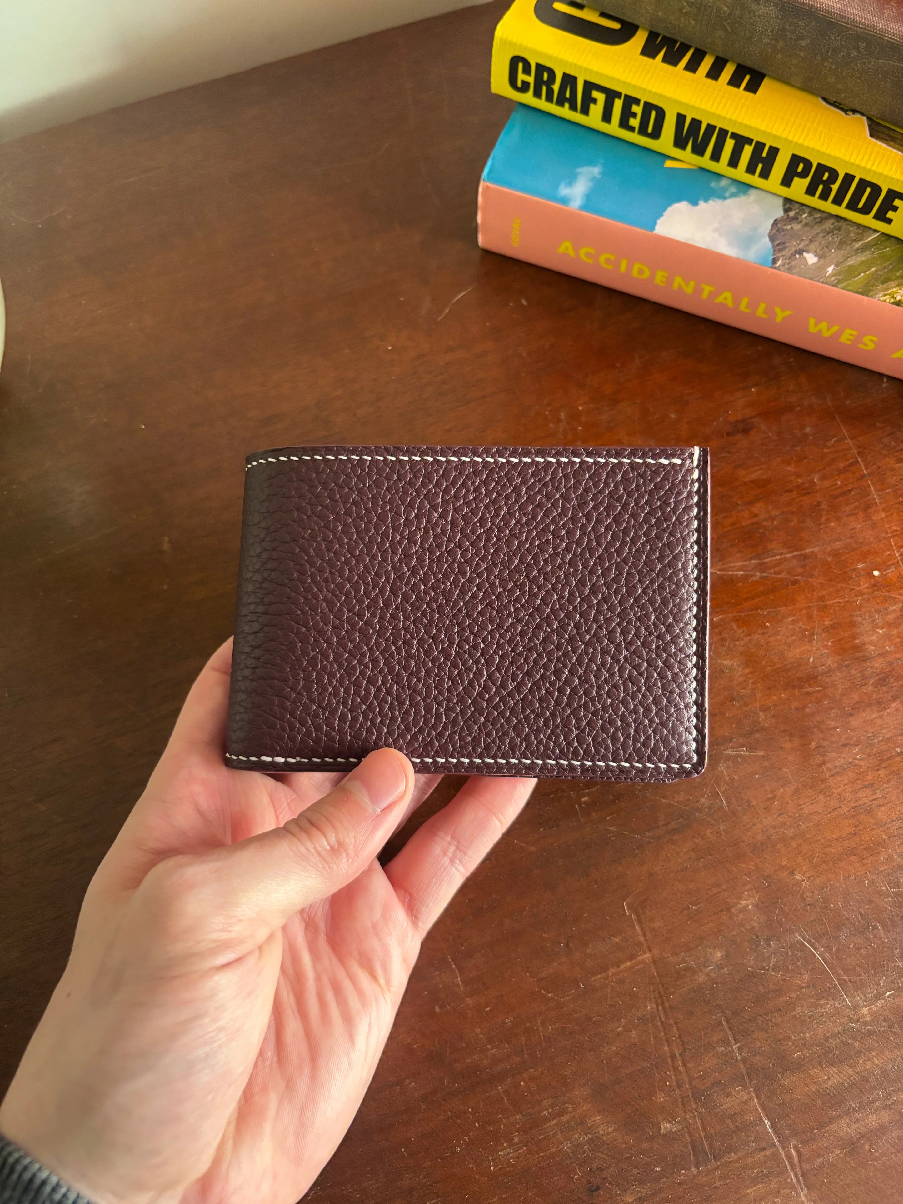 Bronson Leatherworks Bull-Calf Billfold in Rouge Sellier leather, showcasing a sleek, compact accessory with wallet compartments.