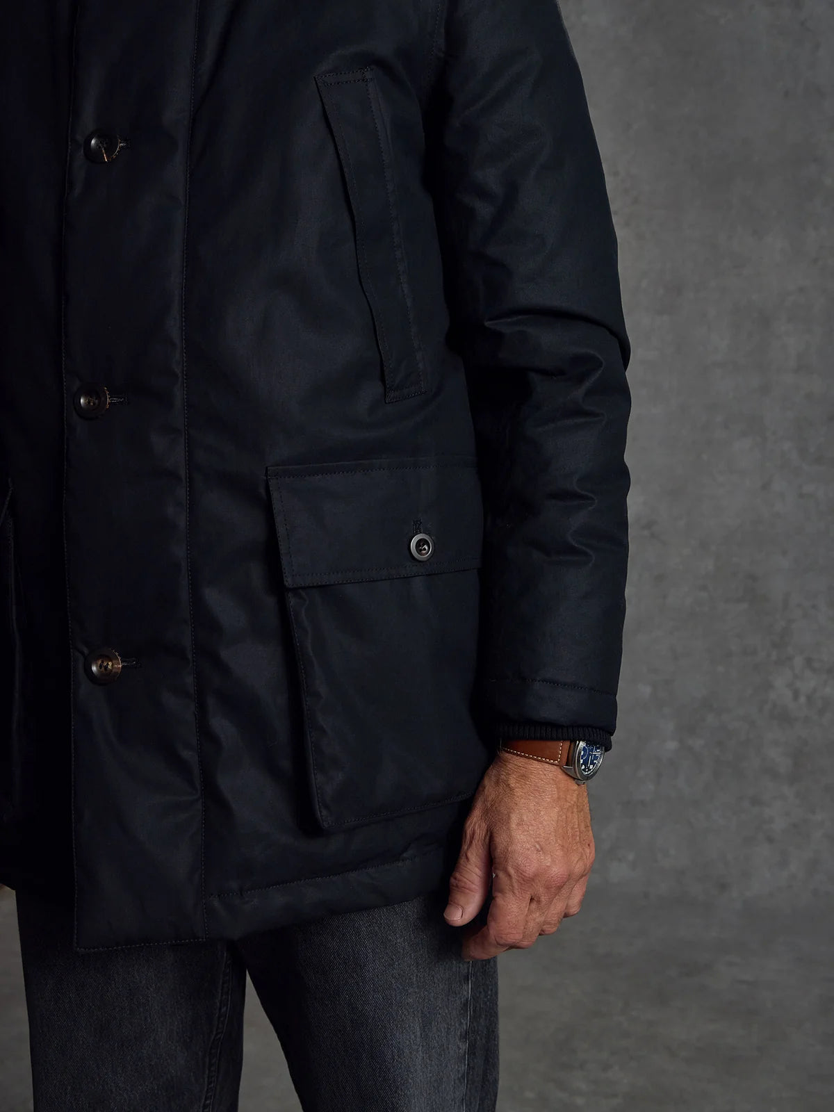 Black Shadow Parka by Private White V.C. featuring a sleek silhouette, front zipper, and adjustable hood, designed for modern outdoor wear.