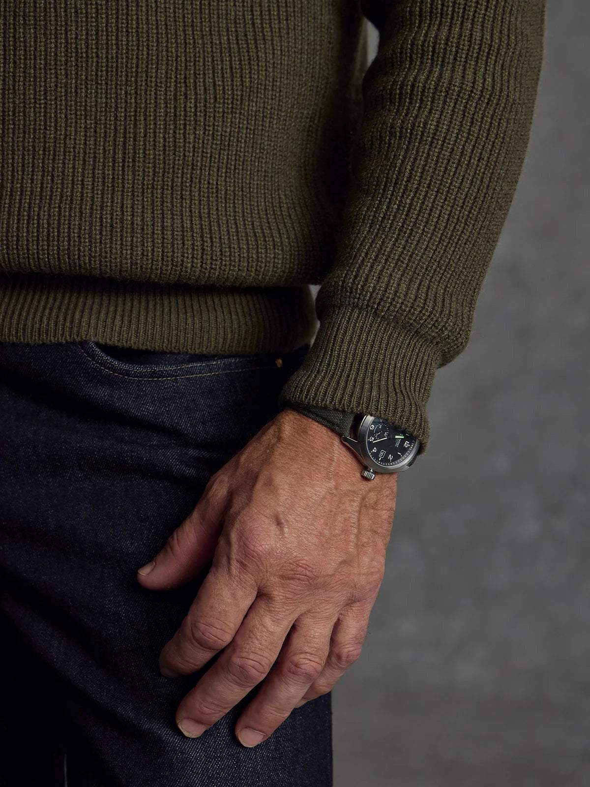 Private White V.C. men's dark green cashmere crewneck sweater, soft and stylish clothing item shown on a model.