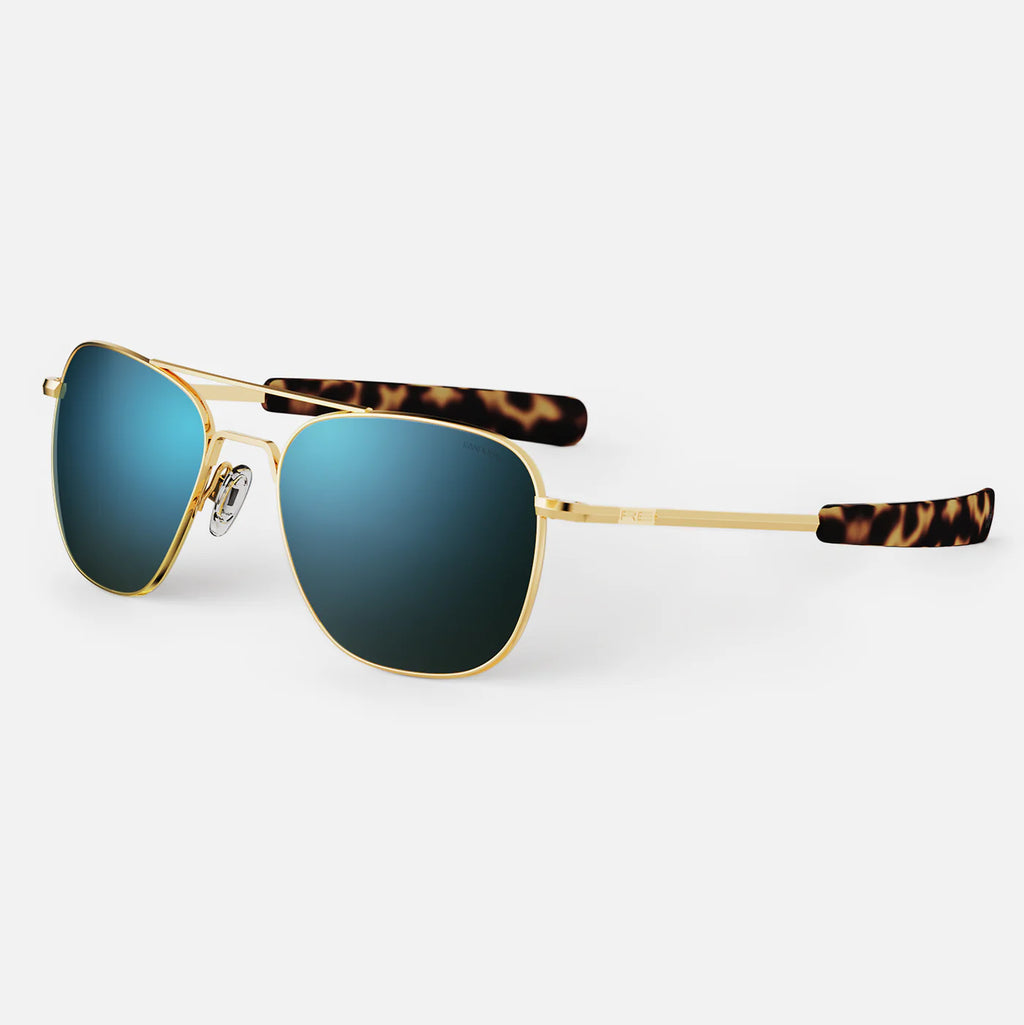 Randolph USA Aviator accessories in 23K gold and cobalt with sleek design and high-quality finish, shown in close-up image.