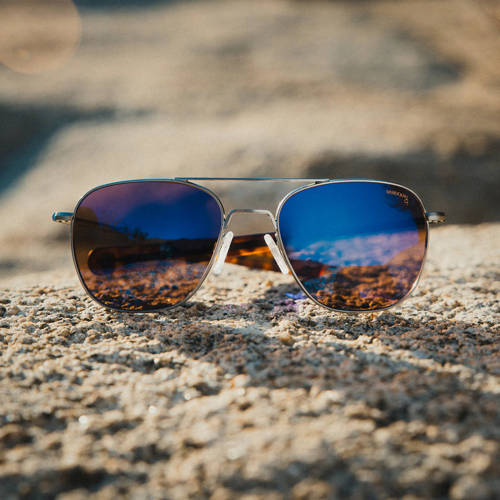 Randolph USA aviator accessories featuring satin gunmetal frames and Le Mans Blue lenses, shown in a close-up view.