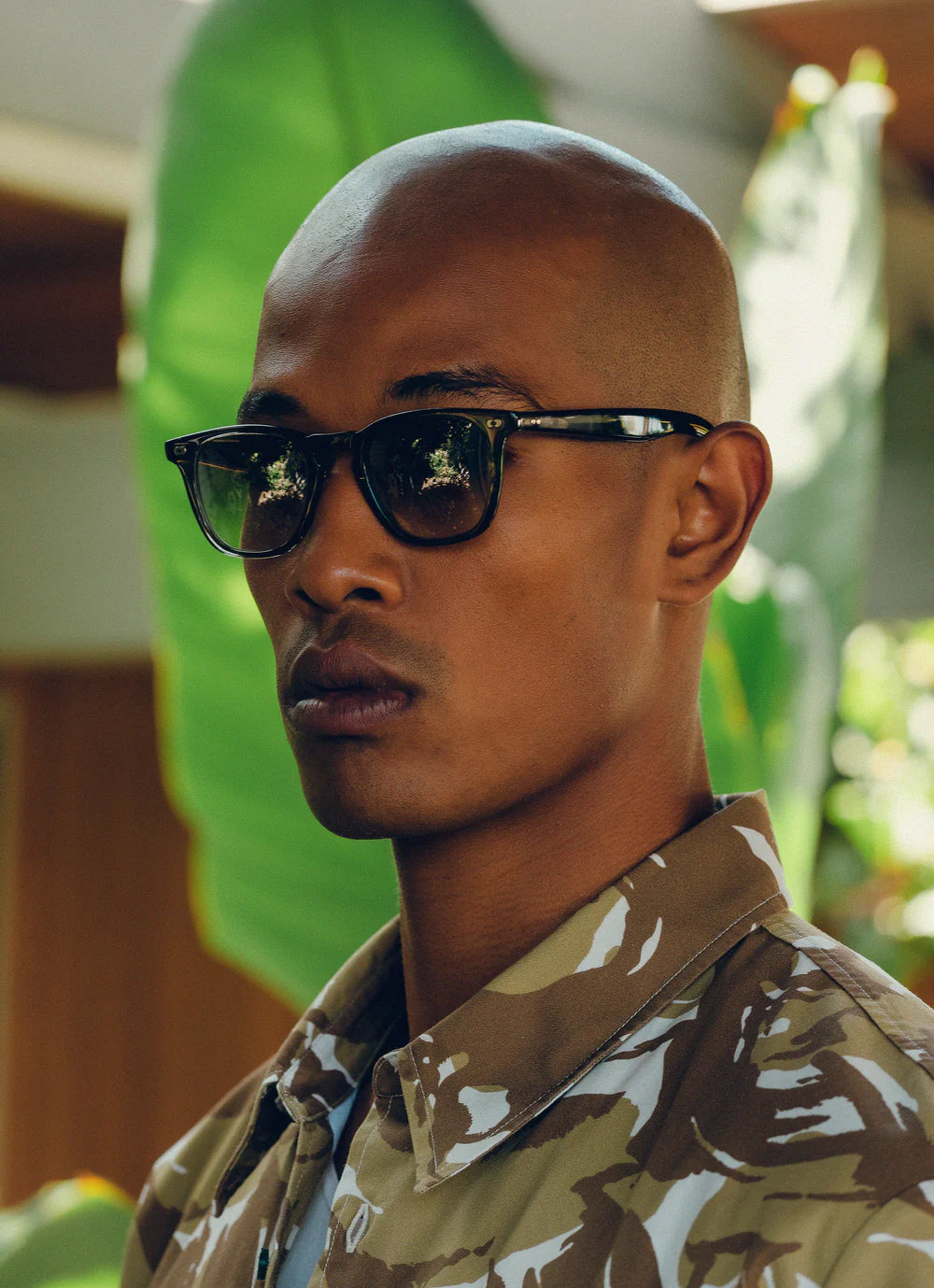 Garrett Leight Brooks X sunglasses in matte black with blue smoke lenses, stylish accessories for sun protection and fashion.