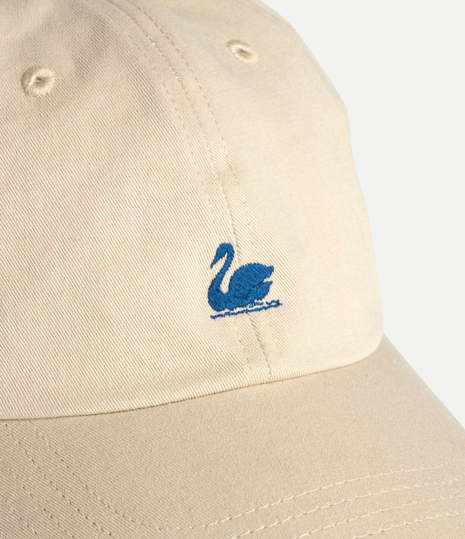 Khaki cotton twill cap with Merz b Schwanen swan logo embroidery, stylish accessories for casual wear.