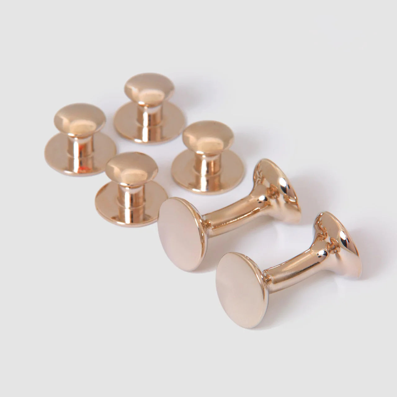 Rose gold bow stud earrings from Codis Maya, featuring a delicate brass design perfect for accessories and everyday wear.