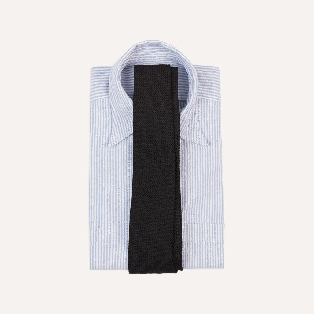 Black large knot Grenadine handrolled tie by Drake's, showcasing its textured fabric and classic style perfect for formal accessories.