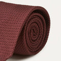 Large knot Grenadine handrolled tie in wine color by Drake's, featuring a textured fabric and classic design for formal accessories.