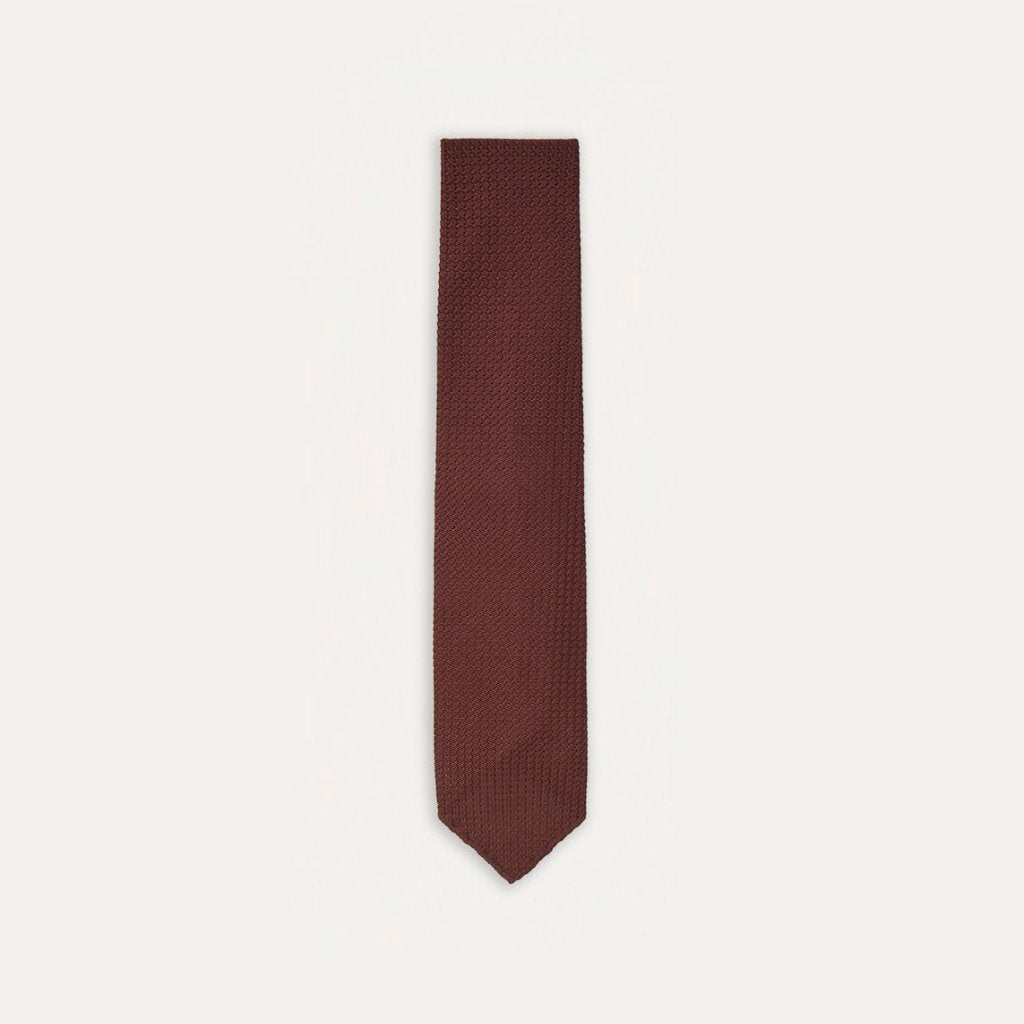 Large knot grenadine handrolled tie in wine color by Drake's, featuring a textured fabric and classic style for accessories.