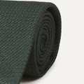 Green large knot Grenadine handrolled tie by Drake's, featuring a classic textured pattern, styled as an elegant accessory.
