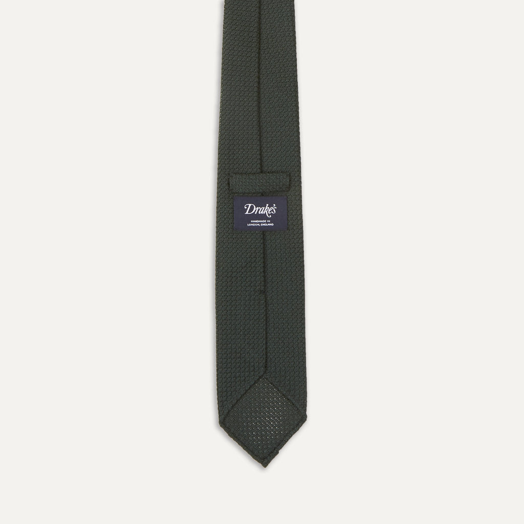 Green large knot Grenadine handrolled tie by Drake's, showcasing its rich color and craftsmanship with detailed knot and texture.