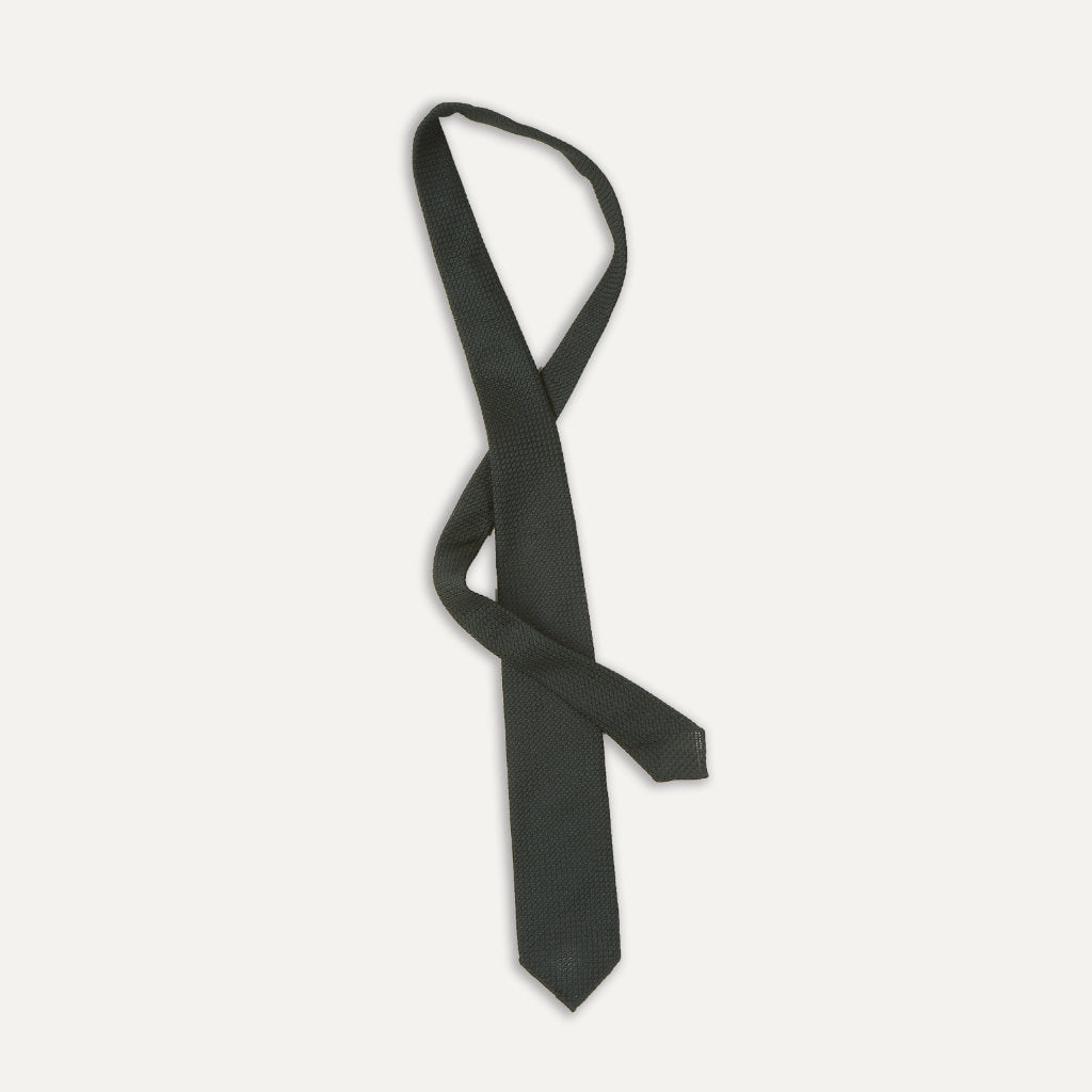 Green large knot Grenadine handrolled tie by Drake's, showcasing its textured fabric and classic knot style for formal accessories.