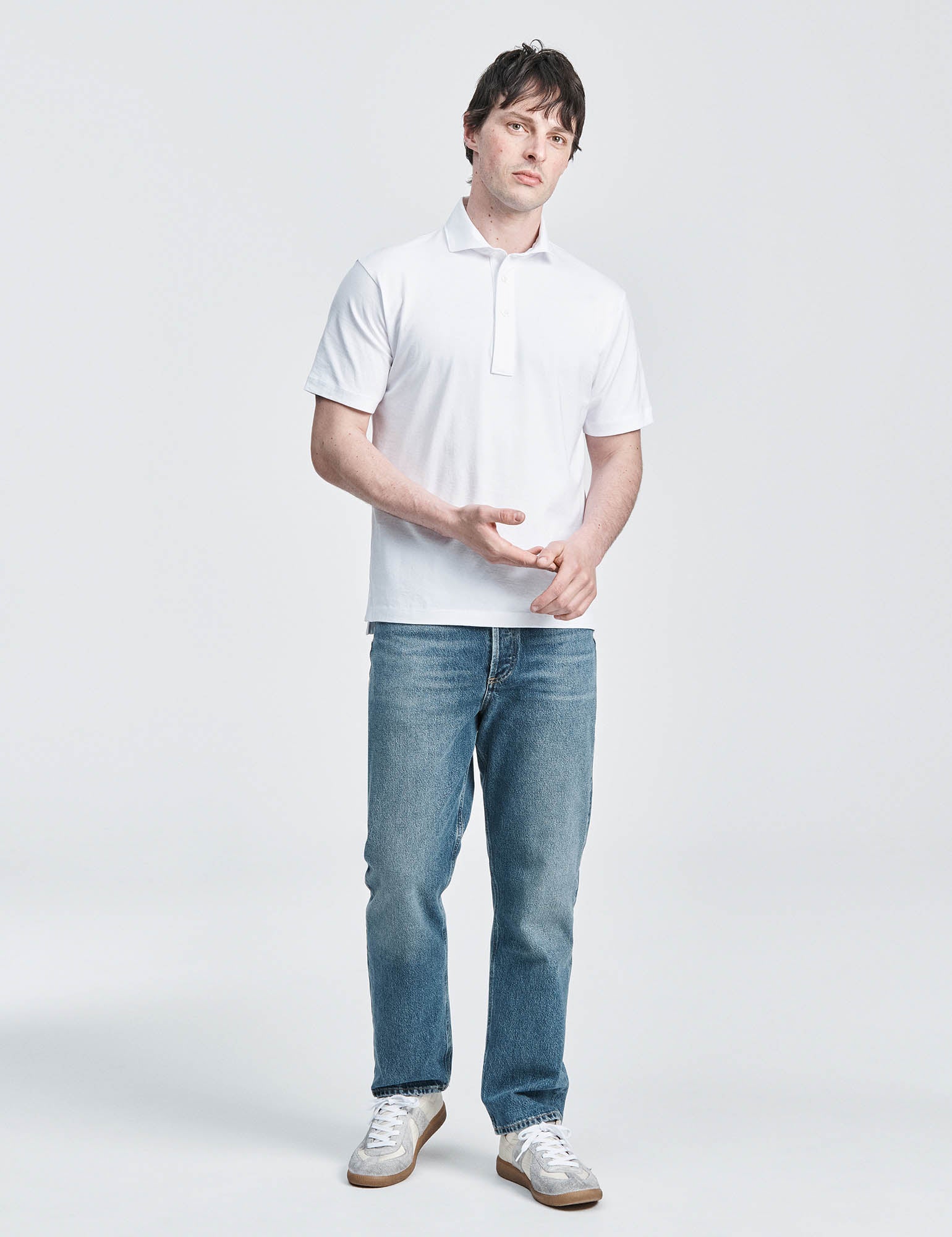White spread collar jersey polo shirt by håndværk, featuring a classic design and tailored fit for men's casual wear.