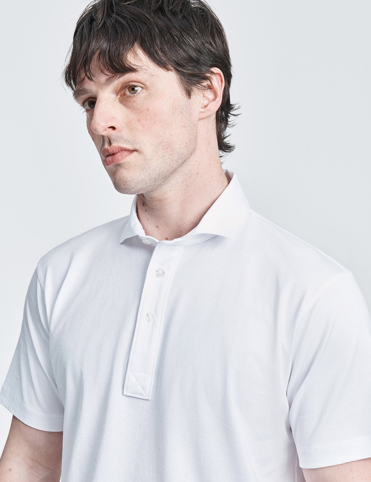 White spread collar jersey polo shirt by håndværk, casual men's clothing with a clean, classic design.