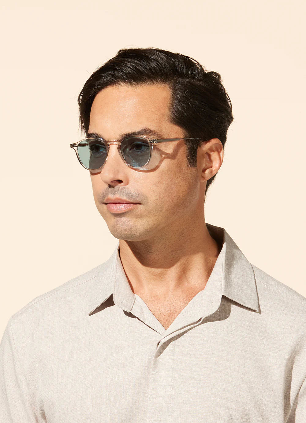 Garrett Leight Hampton sunglasses with champagne semi-flat frames and green tinted lenses, stylish accessories for sunny days.