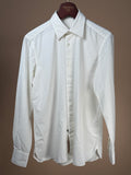 Off-White denim button-up shirt from 100Hands, featuring classic collar and button closure, displayed flat on a neutral background.