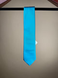 Bright blue solid silk tipped tie from Paolo Albizzati, showcasing its smooth fabric and elegant design.