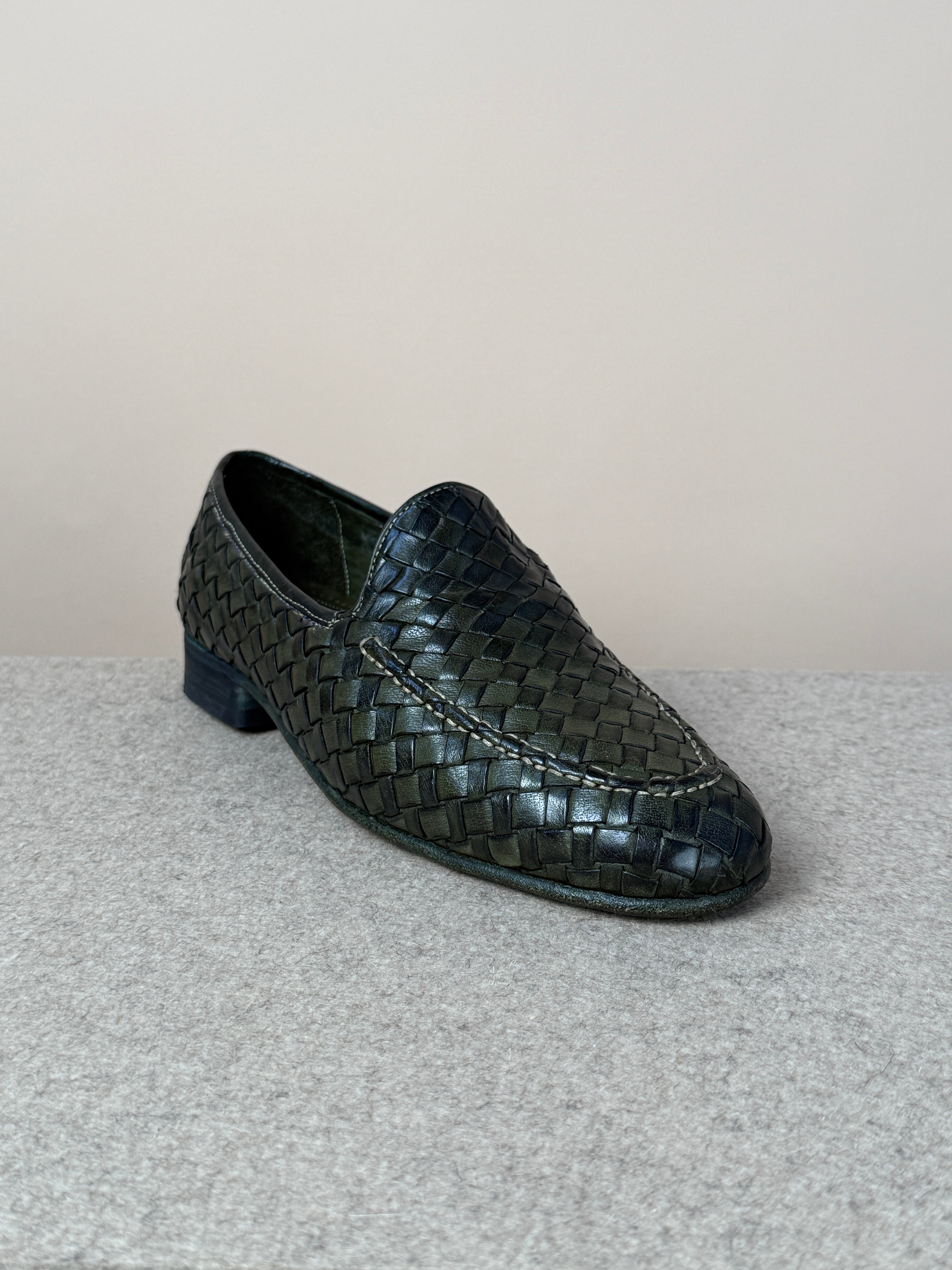 Green Dolcevita woven loafers by Mario Bemer, showcasing stylish woven textile design and classic slip-on footwear style.