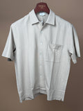 Håndværk foam pique button-up short sleeve shirt displayed on a hanger, showcasing its casual, textured fabric and classic fit.