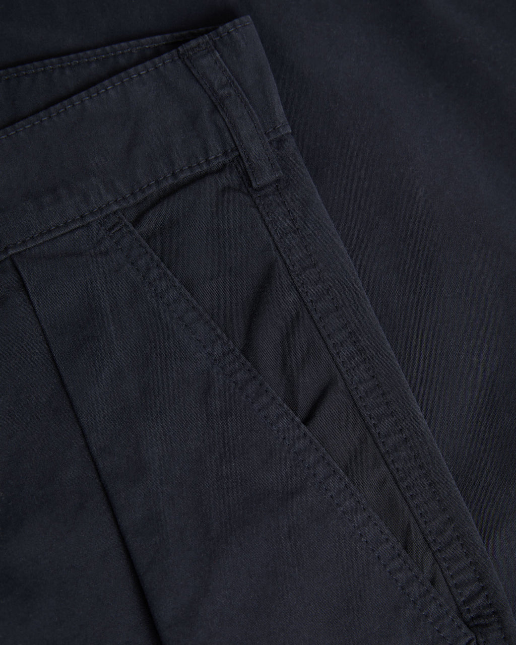 Dark navy Lapa Canvas Pleated Shorts by La Paz, showing the relaxed fit and pleated design on the front.