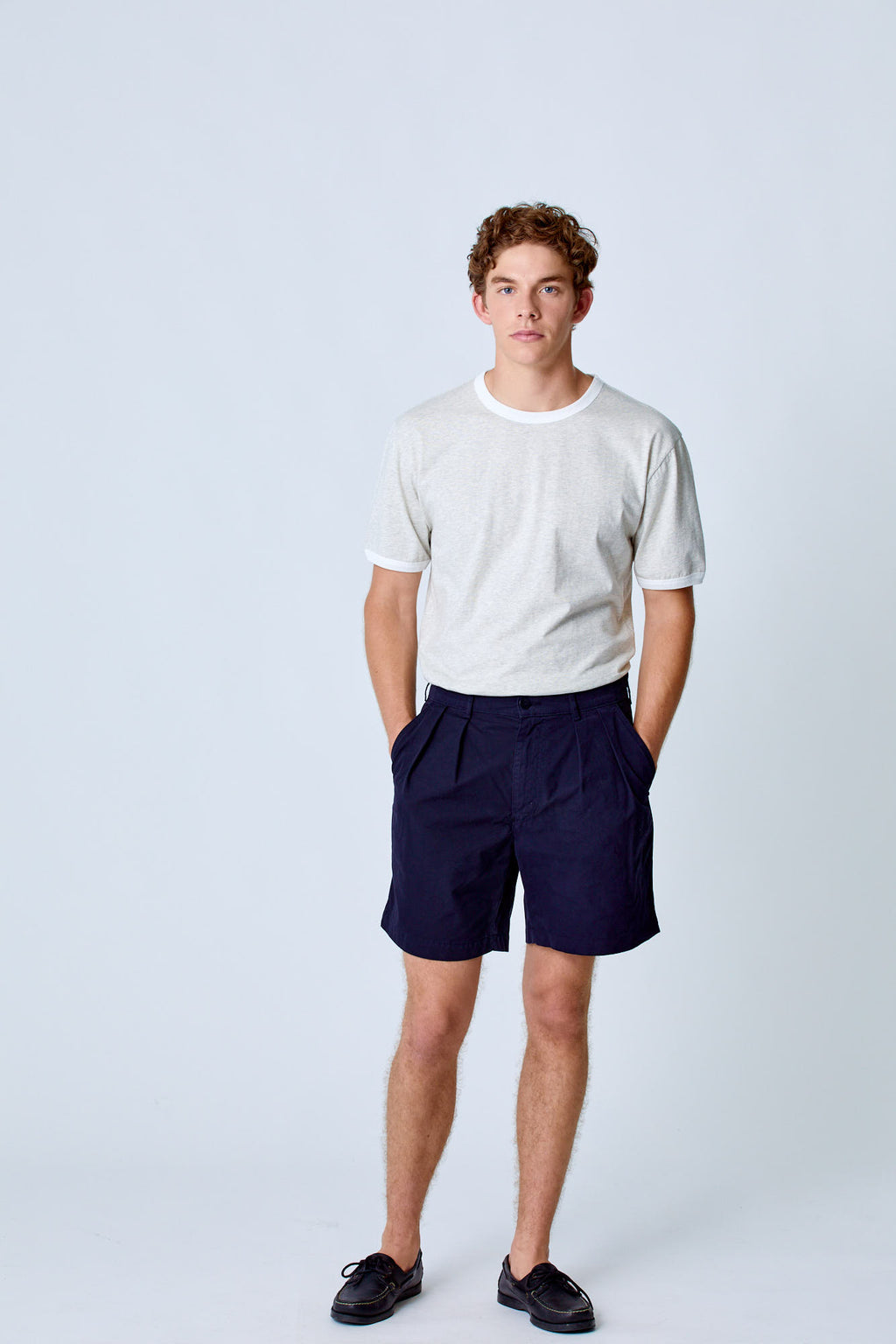 Dark navy Lapa Canvas Pleated Shorts by La Paz, shown in a casual clothing style with pleats and a relaxed fit.