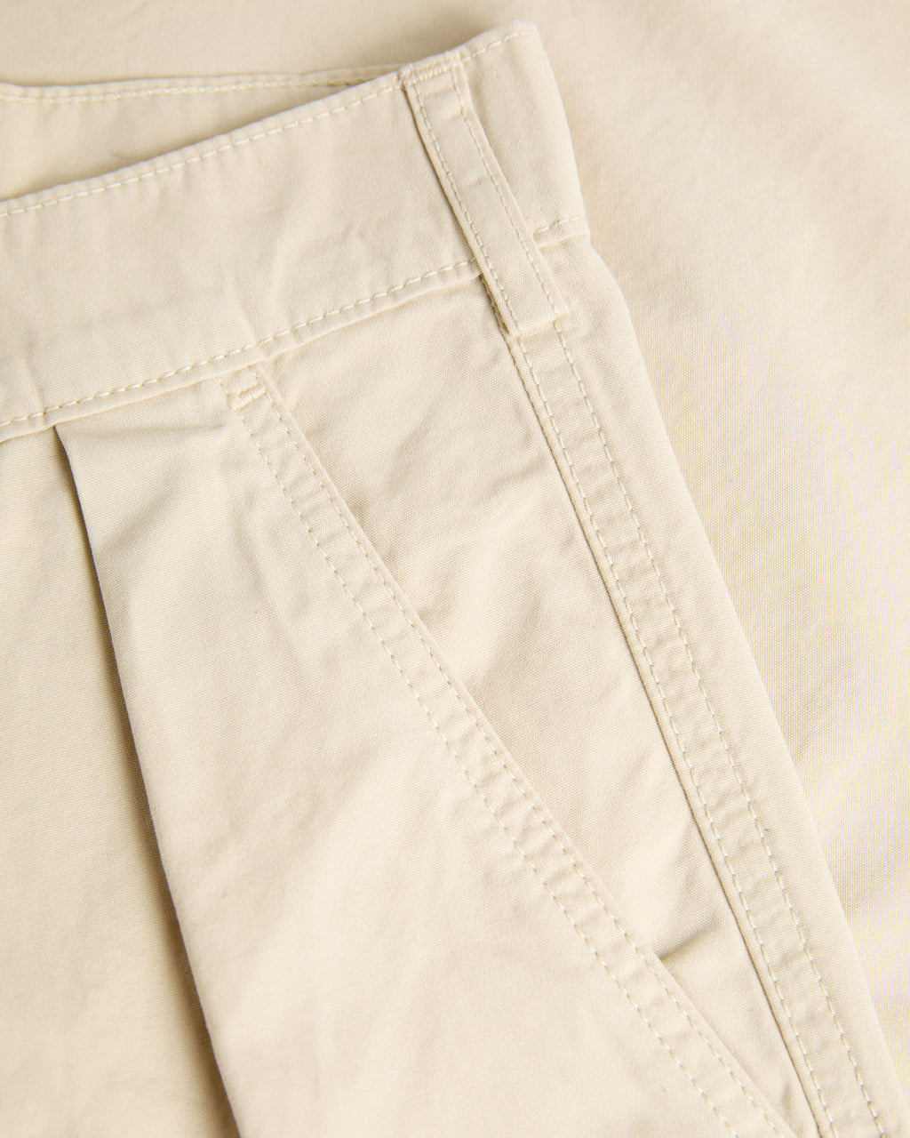 Cream Lapa Canvas Pleated Shorts by La Paz, featuring a relaxed fit and pleated design, displayed on a neutral background.