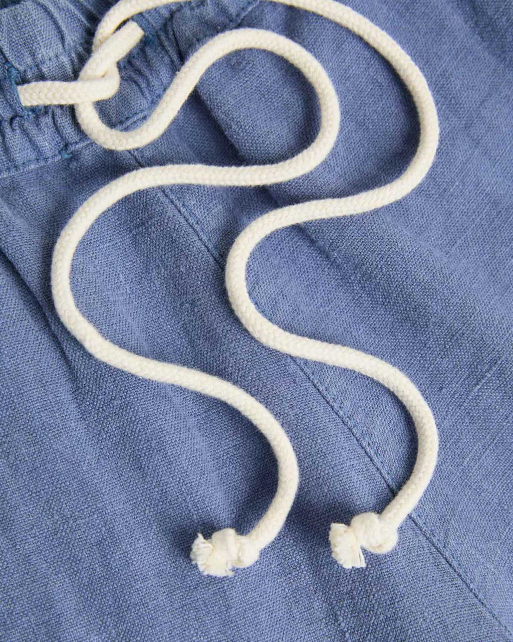 Blue Pestana linen lounge shorts by La Paz, shown on a model, featuring a relaxed fit and casual style.