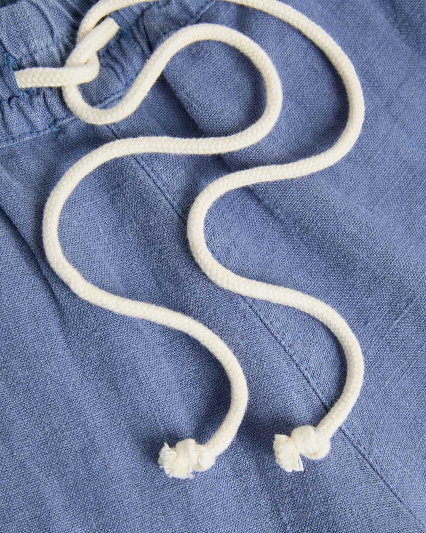 Blue Pestana Linen Lounge Shorts by La Paz, displayed flat with a drawstring waist and relaxed fit, casual clothing for comfort.