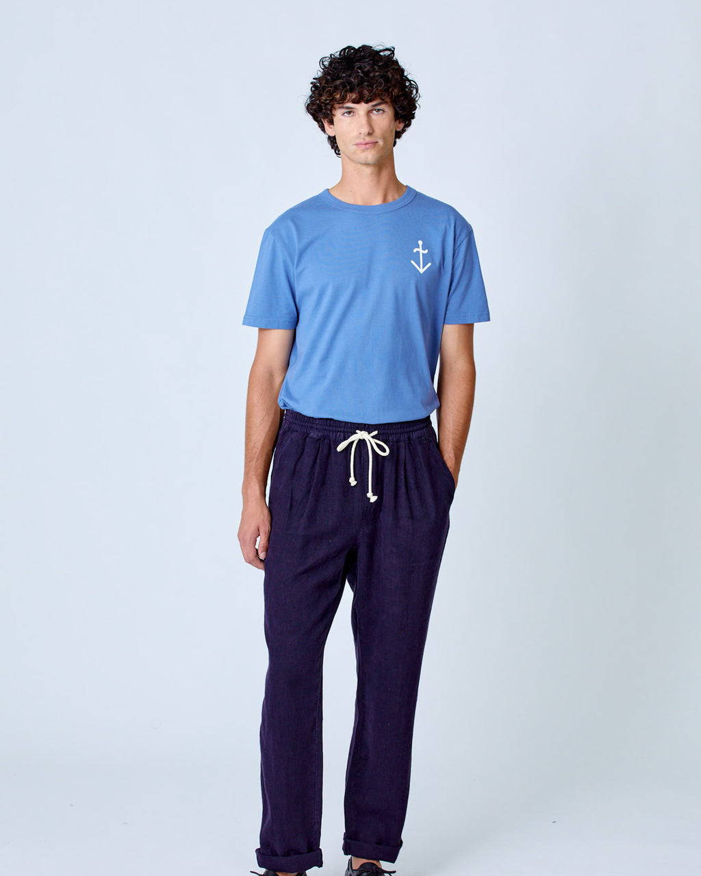 Dark navy La Paz Ponte Linen Lounge Pants displayed on a hanger, showcasing relaxed-fit casual clothing for comfortable wear.