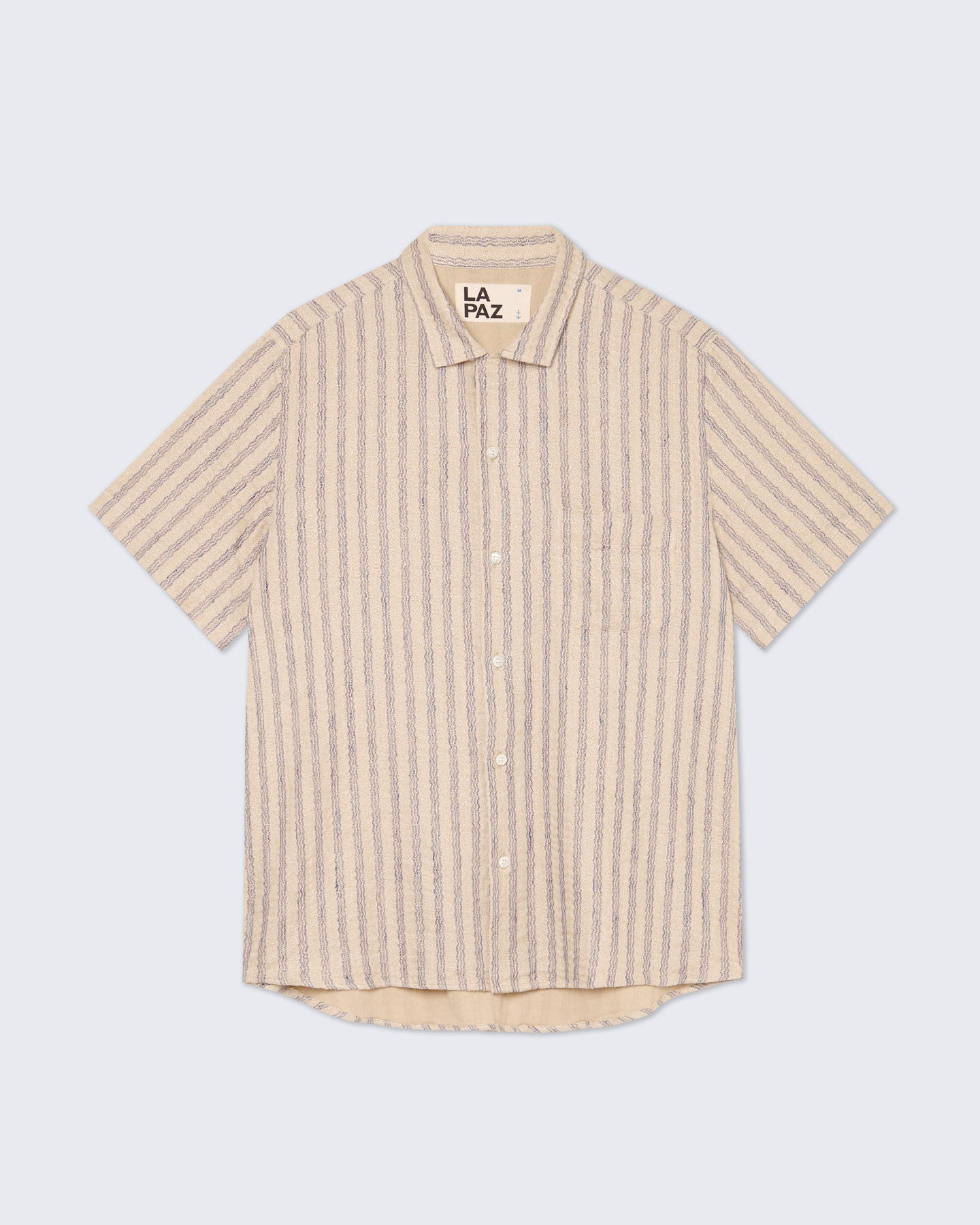 Blue striped Silveira shirt by La Paz, casual clothing with a classic button-up design and collar, displayed on a hanger.
