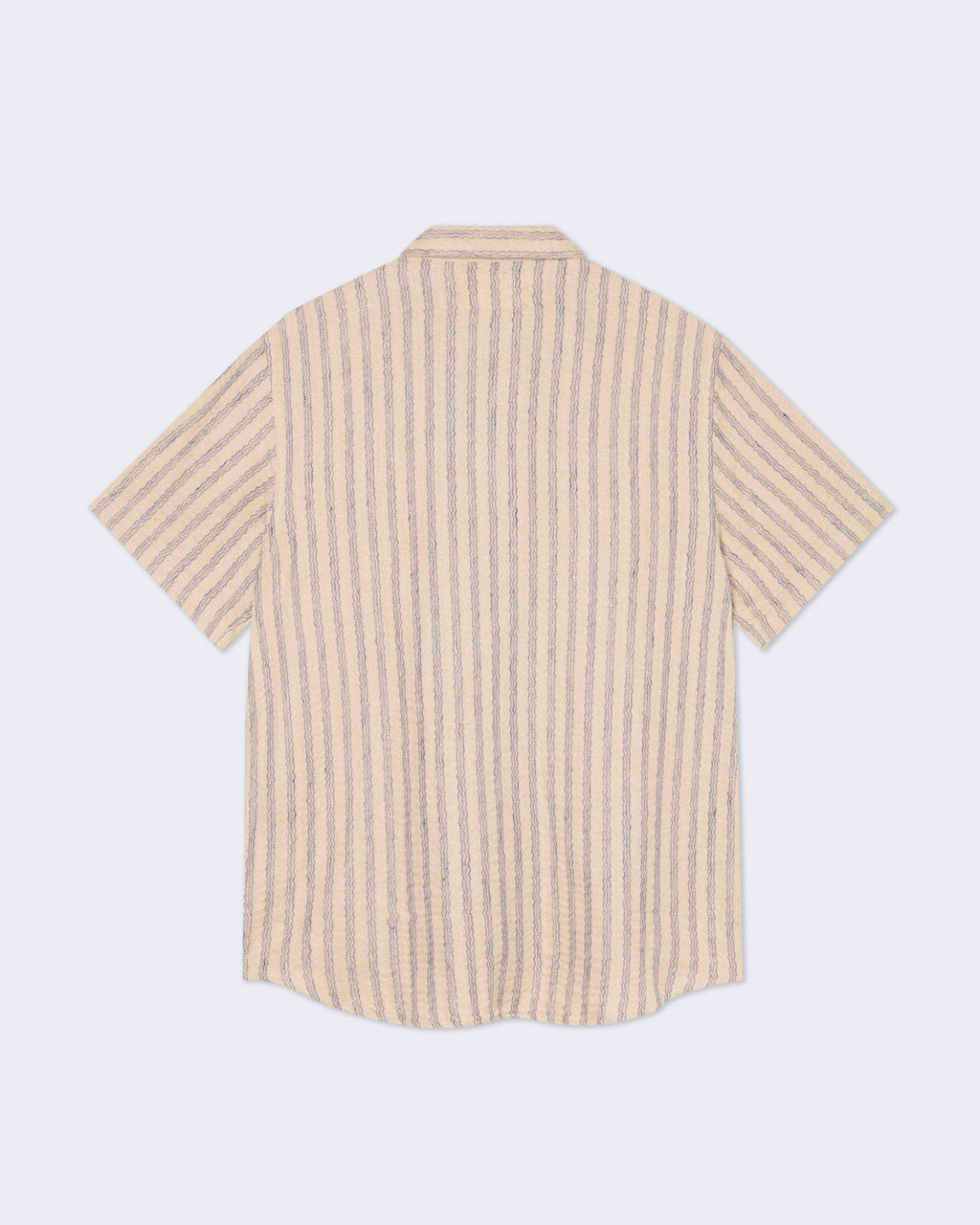 Blue striped Silveira shirt by La Paz, shown on a hanger with a classic collar and button-up front.