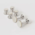 Mother of pearl and rhodium bow stud earrings by Codis Maya, elegant silver accessories with a sleek bow design.