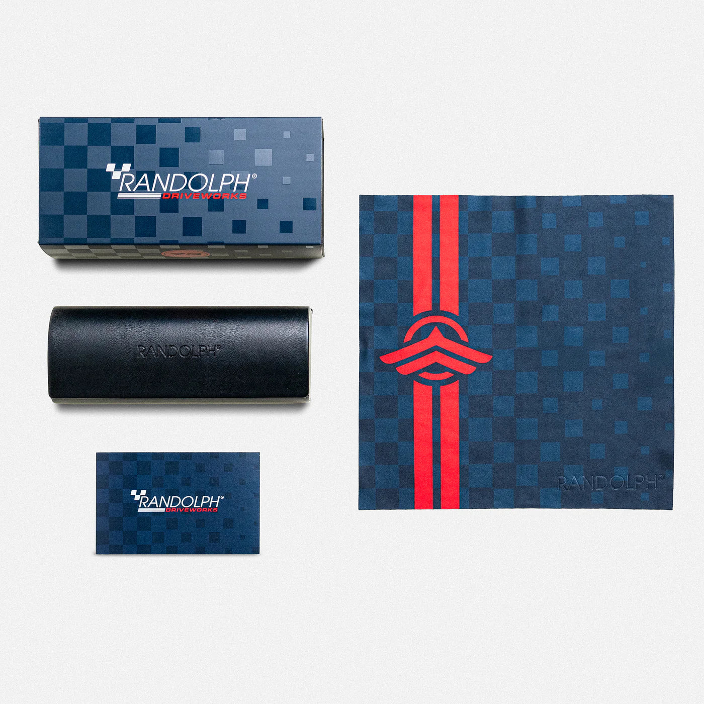 Randolph USA Aviator satin gunmetal and Le Mans Blue accessories packaging with product branding and sleek design.