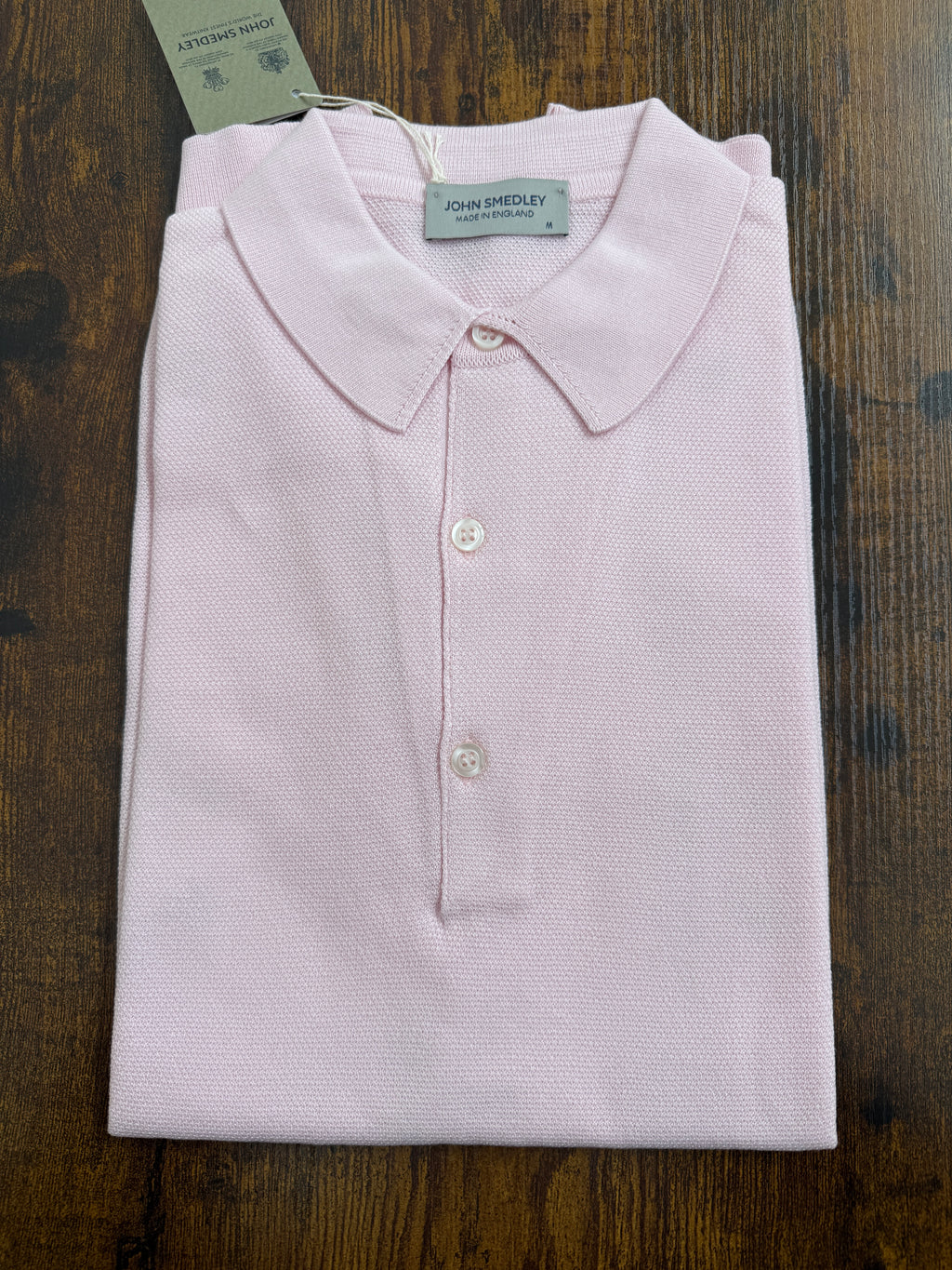 John Smedley Sea Island Cotton Pique Polo in Roth Pink, close-up of the soft, textured cotton fabric and classic polo collar.