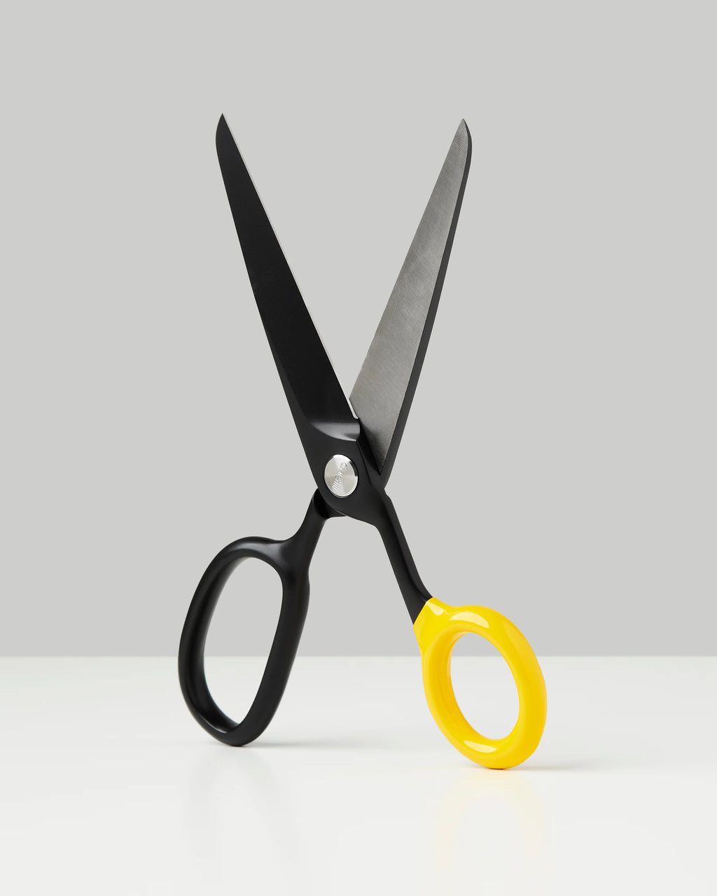 Black Craighill Chroma Scissors, sleek accessories with sharp blades, shown in a close-up image highlighting their modern design.
