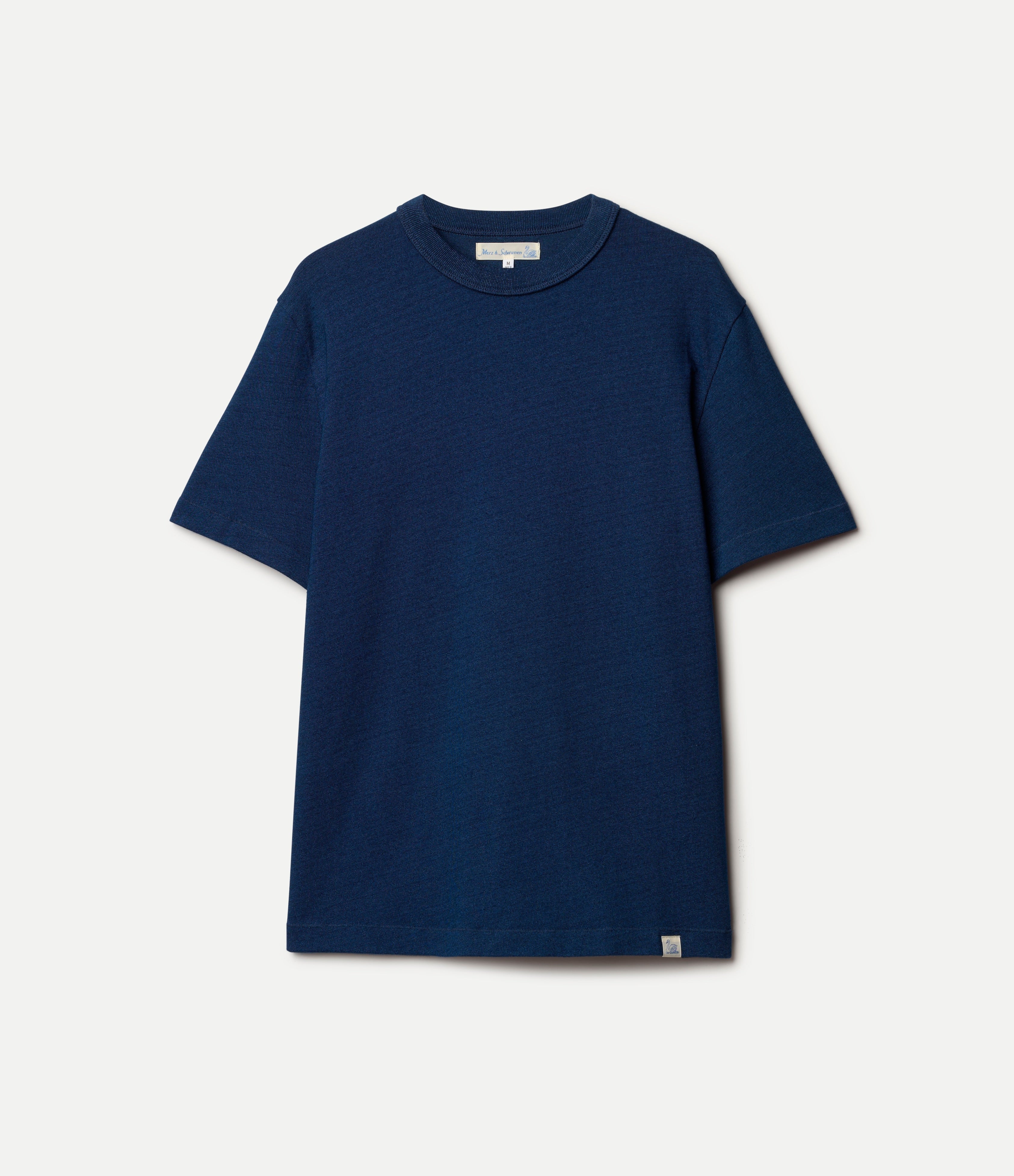 Indigo Merz b Schwanen Supple Jersey Cotton T-Shirt with round neckline and short sleeves, laid flat on a white background.
