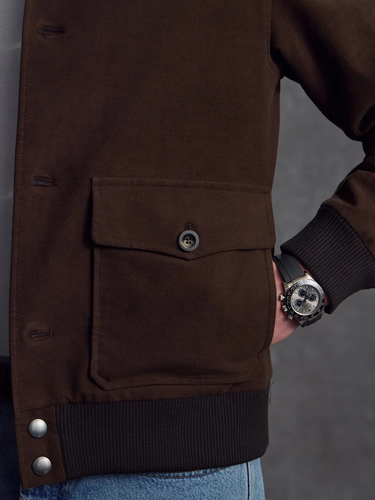 Brown Moleskin Bomber jacket by Private White V.C., shown on a hanger with detailed fabric texture.