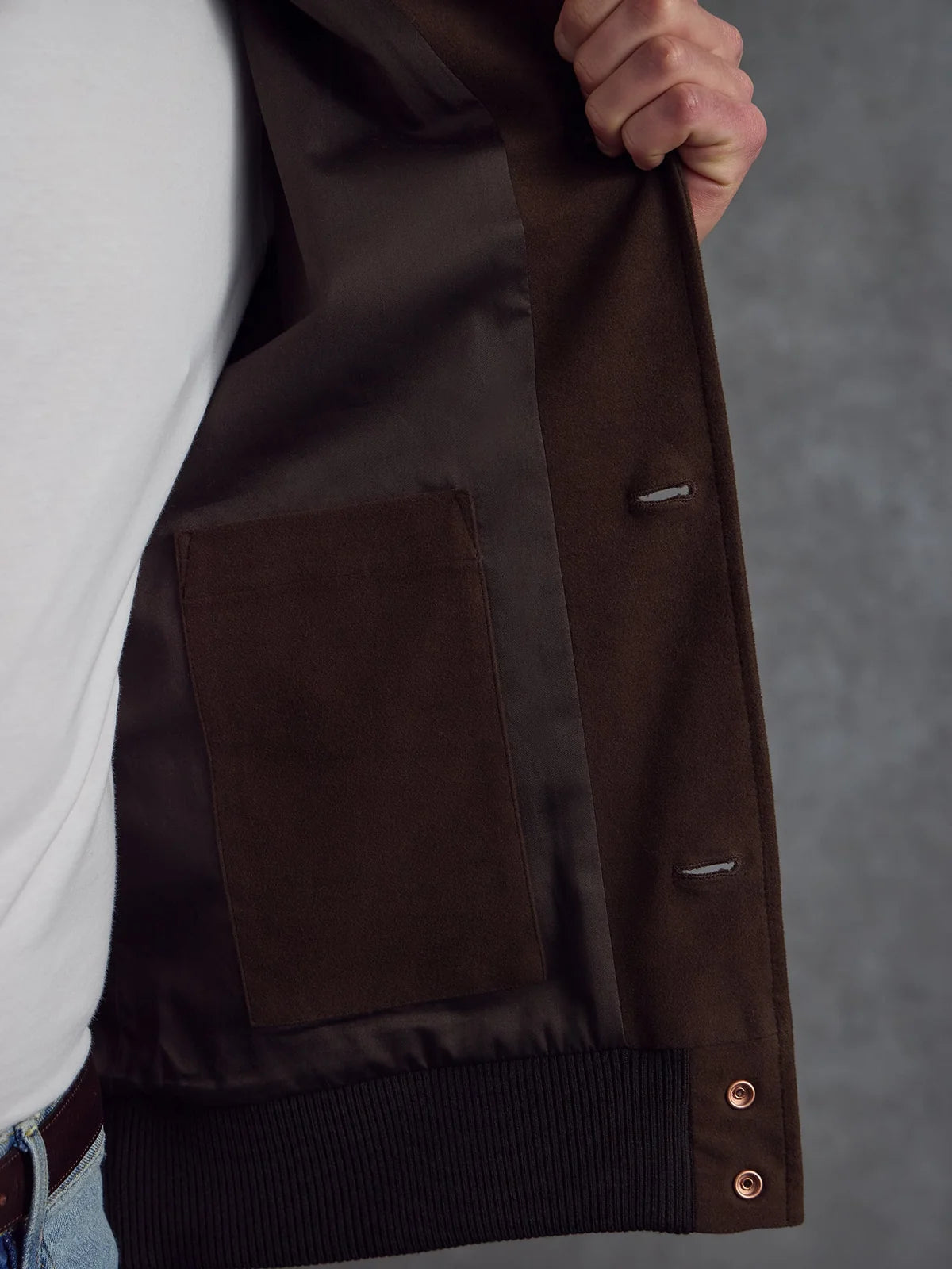 Brown Moleskin Bomber jacket by Private White V.C. with a structured collar and front pockets, displayed on a hanger.