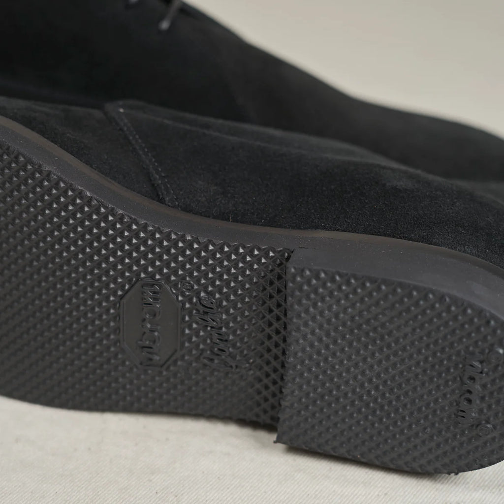 Black suede Voyager Chukka boots by August Special, showcasing stylish footwear with a sleek design and comfortable fit.