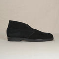 Black suede Voyager Chukka boots by August Special, showcasing the stylish ankle-height footwear with sleek design and textured suede finish.