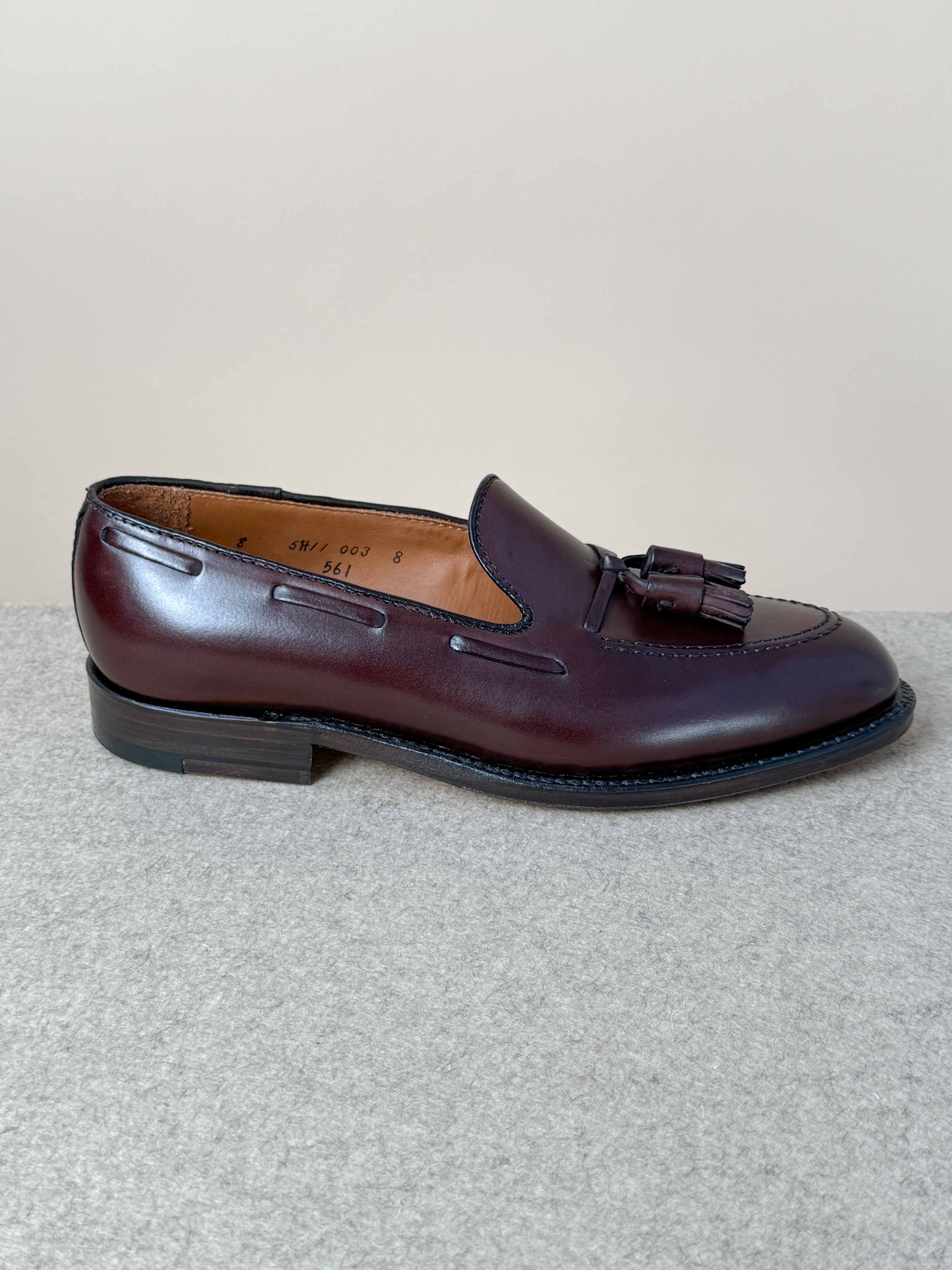 Dark brown calfskin tassel loafers by Alden featuring classic slip-on design and elegant tassel details.