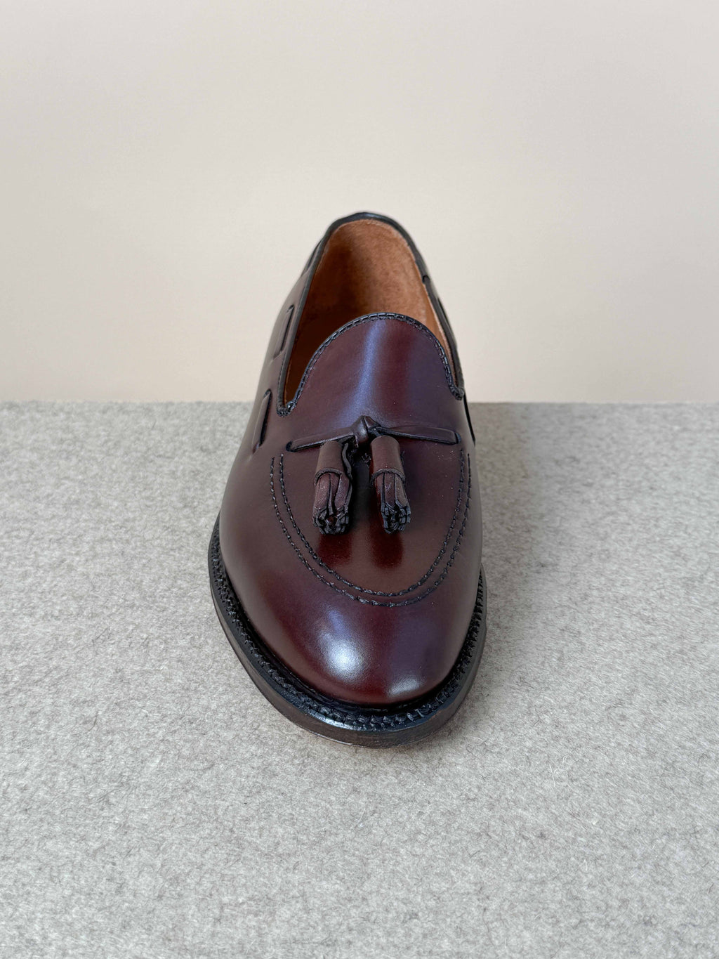 Dark brown calfskin tassel loafers by Alden, stylish men's footwear with classic tassel details and sleek leather finish.