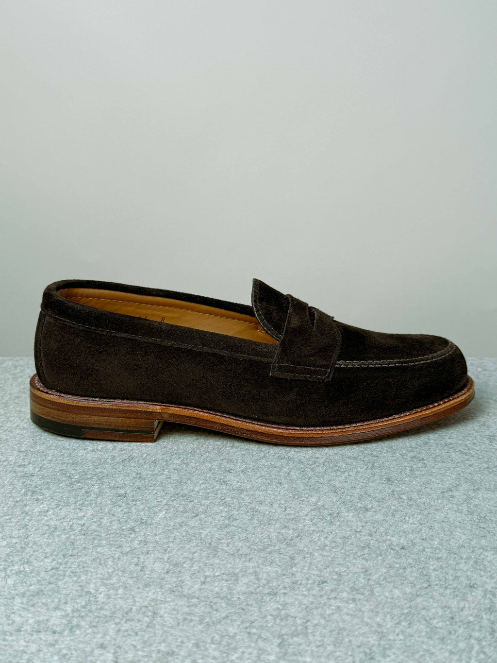 Chocolate suede Alden Leisure Penny Loafer footwear with a classic slip-on design and moccasin-style stitching.