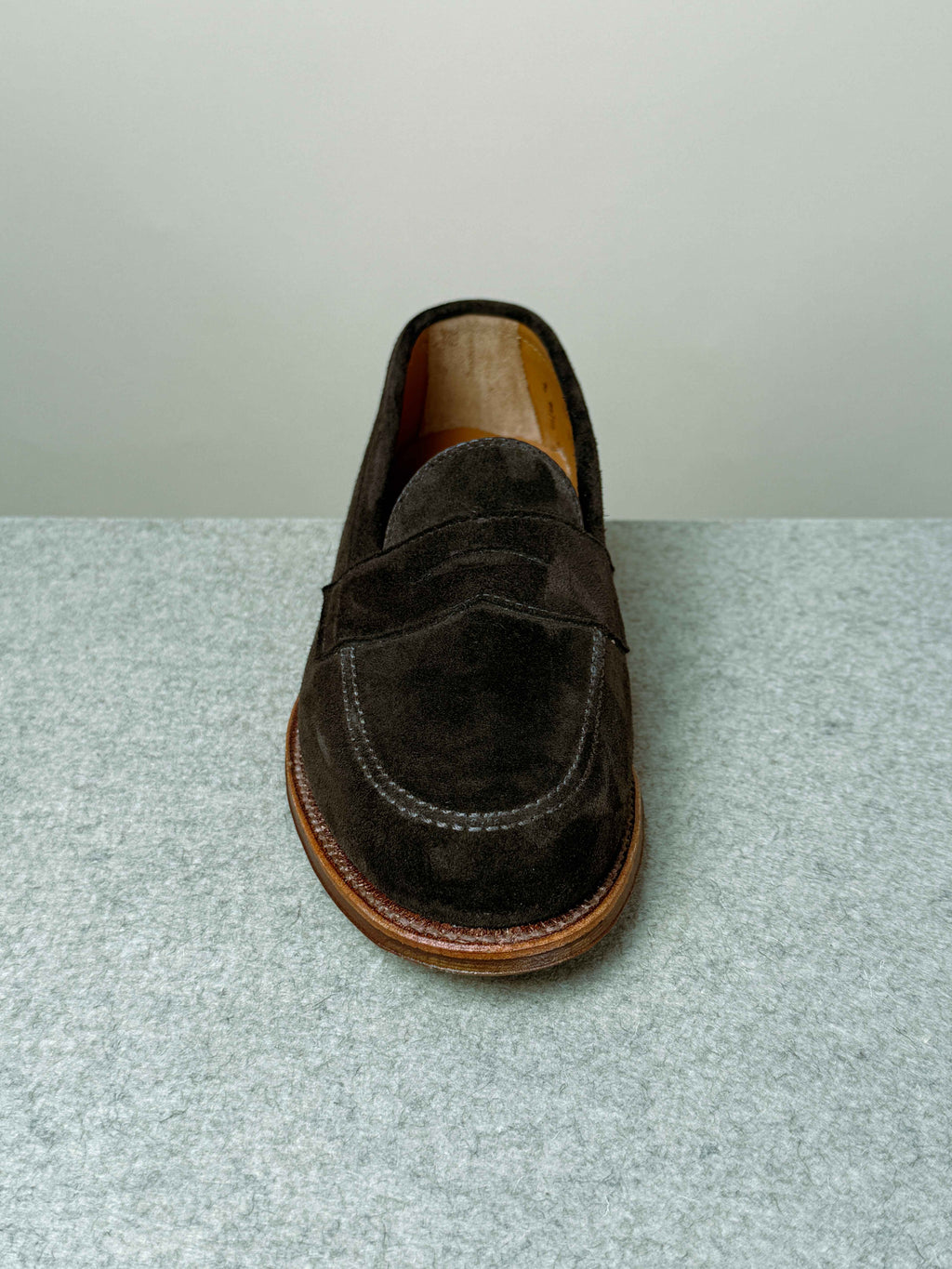 Alden Leisure Penny Loafer in chocolate suede, showcasing smooth leather upper and classic penny strap design.