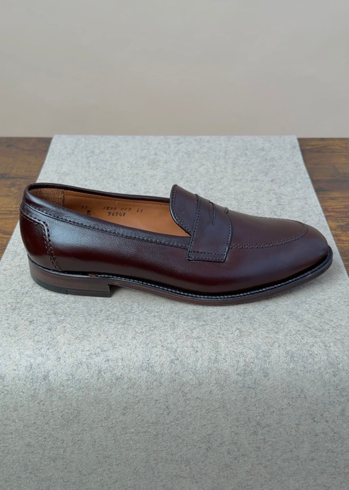Alden Copley Penny Loafer in dark brown soft calfskin, showing a classic slip-on footwear design with a smooth leather finish.