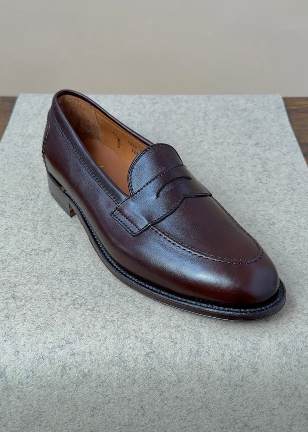 Alden Copley Penny Loafers in dark brown soft calfskin, showcasing classic slip-on footwear with sleek stitching and smooth leather finish.