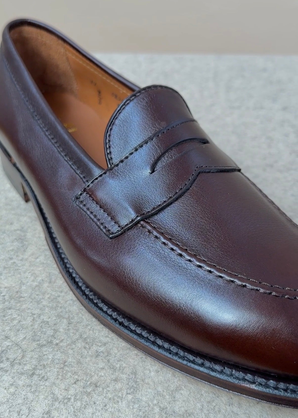 Dark brown Alden Copley Penny Loafer made of soft calfskin leather, showcasing classic slip-on footwear style.