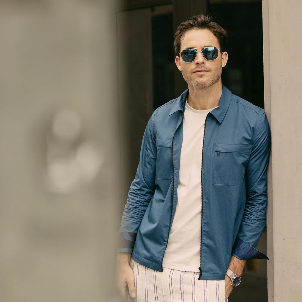 Randolph USA Aviator accessory featuring 23K white gold and AGX glass, shown as a stylish lifestyle image.