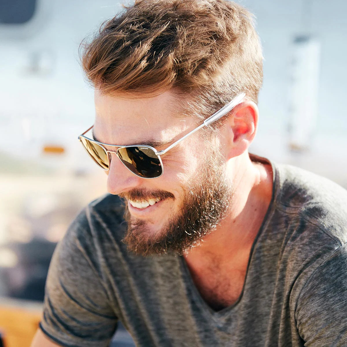 Randolph USA Aviator accessories with matte chrome finish, shown in a lifestyle setting highlighting their stylish design.