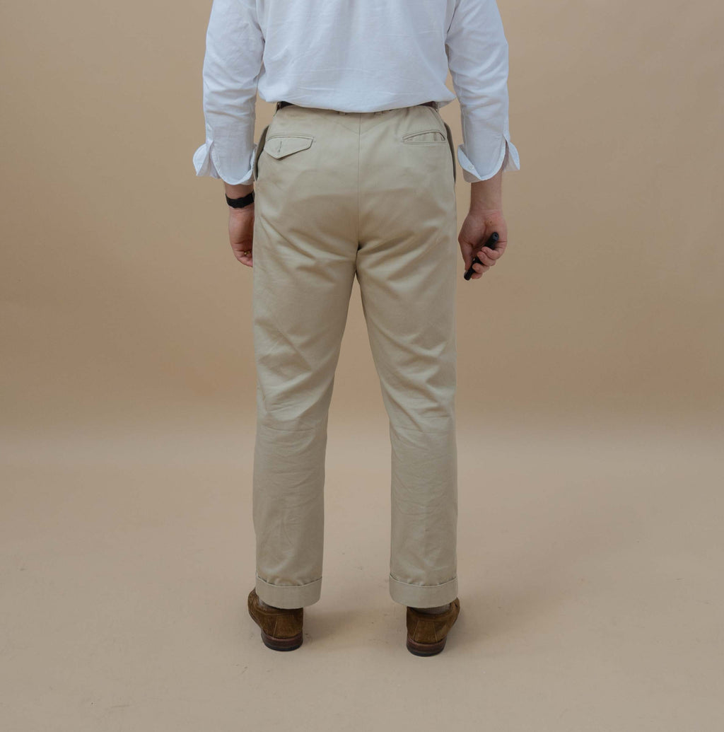 man wearing chinos facing away
