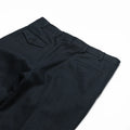 Black linen cotton trousers by J.Mueser, featuring a relaxed fit and classic design, shown on a plain background.